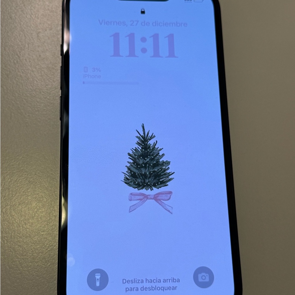 Apple iPhone with Christmas Tree Wallpaper